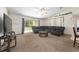 Bright living room with large sectional sofa and sliding glass doors at 14650 Sw 33Rd Ln, Ocala, FL 34481