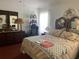 Inviting bedroom with a comfortable bed, dresser, and natural light at 1815 Puerto Bello Dr, The Villages, FL 32159