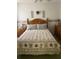 Serene bedroom with bright lighting, comfortable bedding, and wooden furniture at 1815 Puerto Bello Dr, The Villages, FL 32159