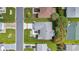 Aerial view of home with well-manicured lawn and tidy landscaping at 1819 Captiva Ct, The Villages, FL 32162