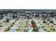 Aerial view of property in a community with tree-lined streets at 1819 Captiva Ct, The Villages, FL 32162