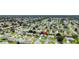 Aerial view of a neighborhood close to golf course and lake at 1819 Captiva Ct, The Villages, FL 32162