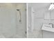 Modern bathroom with a large marble-look shower, and updated vanity at 1819 Captiva Ct, The Villages, FL 32162