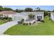 Inviting single-story home boasts a well-kept lawn and beautifully designed landscaping at 1819 Captiva Ct, The Villages, FL 32162