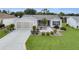 Charming single-story home features a well-manicured lawn and inviting landscaping at 1819 Captiva Ct, The Villages, FL 32162
