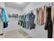 Well-organized walk-in closet with ample hanging space and shelving at 1819 Captiva Ct, The Villages, FL 32162