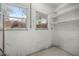Unfinished basement featuring windows for natural light and shelving for storage at 1831 Sw 5Th Ave, Ocala, FL 34471