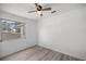 Neutral bedroom featuring new flooring, white walls, and a bright window at 1831 Sw 5Th Ave, Ocala, FL 34471