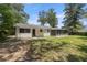 Charming single-story home with a large lawn, mature trees, and a screened patio at 1831 Sw 5Th Ave, Ocala, FL 34471