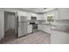 Renovated kitchen with stainless steel appliances, granite countertops, and ample cabinet space at 1831 Sw 5Th Ave, Ocala, FL 34471