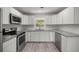 Updated kitchen with new appliances, countertops, and modern cabinetry at 1831 Sw 5Th Ave, Ocala, FL 34471