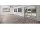 Spacious living room with modern flooring, natural light, and glass sliding doors at 1831 Sw 5Th Ave, Ocala, FL 34471