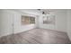 Bright living room with new flooring, neutral walls, and two large windows at 1831 Sw 5Th Ave, Ocala, FL 34471