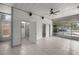 Bright sunroom with tile floors, ceiling fan, and sliding glass doors to the outside at 1831 Sw 5Th Ave, Ocala, FL 34471