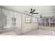 Screened-in sunroom with natural light and ceiling fans at 1831 Sw 5Th Ave, Ocala, FL 34471