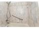 Bathroom featuring a shower/tub with textured tile and chrome fixtures at 19115 Sw 98Th Loop, Dunnellon, FL 34432