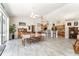 Dining area with access to the kitchen, lots of seating and with wood-look tiled floors at 19115 Sw 98Th Loop, Dunnellon, FL 34432