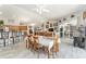 Dining area with wood table and chairs, adjacent to the kitchen and living spaces at 19115 Sw 98Th Loop, Dunnellon, FL 34432