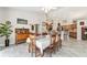 Dining area featuring a dining table and chairs, with adjacent access to kitchen area at 19115 Sw 98Th Loop, Dunnellon, FL 34432