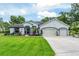 Charming one-story home features a well-manicured lawn, inviting entryway, and three-car garage at 19115 Sw 98Th Loop, Dunnellon, FL 34432