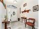 Inviting foyer with wood-look tile, enhanced by stylish furnishings and decor at 19115 Sw 98Th Loop, Dunnellon, FL 34432
