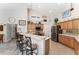 Eat-in kitchen with stainless appliances, a breakfast bar, and decorative accents at 19115 Sw 98Th Loop, Dunnellon, FL 34432