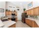 Updated kitchen with stainless appliances, bright cabinets, and decorative accents at 19115 Sw 98Th Loop, Dunnellon, FL 34432