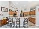 Bright kitchen featuring a breakfast bar and decorative decor with track lighting at 19115 Sw 98Th Loop, Dunnellon, FL 34432