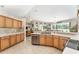 Bright kitchen has stainless appliances, and ample counter space overlooking dining area at 19115 Sw 98Th Loop, Dunnellon, FL 34432