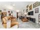 Open living room with vaulted ceiling, tiled floors, and decorated with beautiful art at 19115 Sw 98Th Loop, Dunnellon, FL 34432