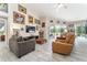 Open living room with tile floors, vaulted ceiling and view of the pool area and backyard at 19115 Sw 98Th Loop, Dunnellon, FL 34432
