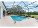 Beautiful backyard pool with a screened-in lanai, offering a serene and private outdoor space at 19115 Sw 98Th Loop, Dunnellon, FL 34432