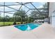 Relaxing screened-in pool area perfect for enjoying the outdoors with privacy and comfort at 19115 Sw 98Th Loop, Dunnellon, FL 34432