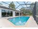 Inviting pool with clear blue water, featuring a tiled edge and screened enclosure for privacy at 19115 Sw 98Th Loop, Dunnellon, FL 34432