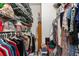 Organized walk-in closet with wire shelving and ample storage space at 19115 Sw 98Th Loop, Dunnellon, FL 34432