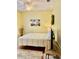 Comfortable bedroom featuring ceiling fan, wood floors, and a mounted television at 19480 Sw 100Th Loop, Dunnellon, FL 34432
