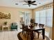 Inviting dining room features a wood table, seating for six, and abundant natural light from a sliding glass door at 19480 Sw 100Th Loop, Dunnellon, FL 34432