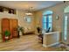 Bright dining room with a decorative screen, laminate flooring, and an arch window at 19480 Sw 100Th Loop, Dunnellon, FL 34432