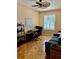 Dedicated home office with lots of natural light, a fan, and a calming sofa at 19480 Sw 100Th Loop, Dunnellon, FL 34432