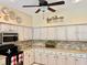 Updated kitchen showcases stainless steel appliances, ample counter space, and neutral countertops, ideal for cooking at 19480 Sw 100Th Loop, Dunnellon, FL 34432