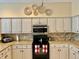 A well-appointed kitchen shows granite countertops, stainless steel appliances and white cabinets at 19480 Sw 100Th Loop, Dunnellon, FL 34432