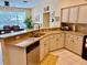 Open floor plan showcases modern kitchen with granite counters, stainless appliances, and a sink overlooking the dining area at 19480 Sw 100Th Loop, Dunnellon, FL 34432