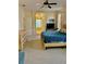 Spacious main bedroom leads to the ensuite bathroom, featuring a king-sized bed and neutral decor at 19480 Sw 100Th Loop, Dunnellon, FL 34432