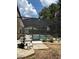 Enclosed pool area featuring pool equipment, a concrete deck, and a privacy screen at 19480 Sw 100Th Loop, Dunnellon, FL 34432