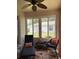 Enclosed sunroom filled with natural light, stylish seating, and a cozy atmosphere at 19480 Sw 100Th Loop, Dunnellon, FL 34432
