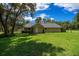 Expansive backyard with lush green lawn surrounding a single-story home at 26 Count Fleet Dr, Ocala, FL 34482