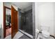 Bathroom features a modern shower with glass door and updated toilet at 26 Count Fleet Dr, Ocala, FL 34482