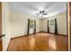 Spacious bedroom features hardwood floors, ceiling fan, and plenty of natural light at 26 Count Fleet Dr, Ocala, FL 34482