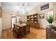 Dining room featuring hardwood floors, natural light, and traditional wood furnishings at 26 Count Fleet Dr, Ocala, FL 34482