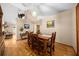 Open dining room area features hardwood floors, neutral color palette, and traditional wood furnishings at 26 Count Fleet Dr, Ocala, FL 34482